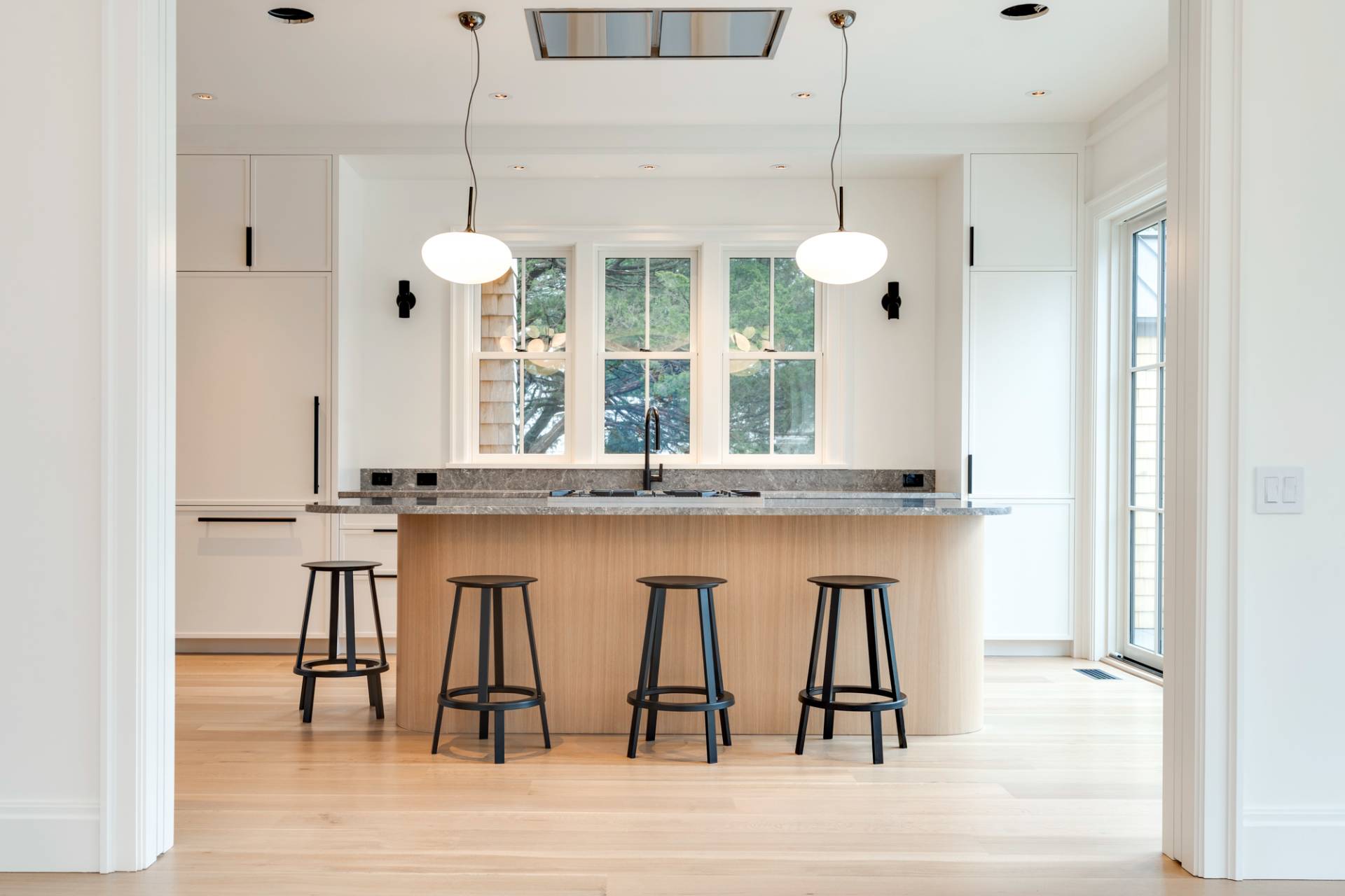 27 Sunset Road Sag Harbor, NY 11963 - Photo 13 of 45 a dining room with wooden floor and a chandelier