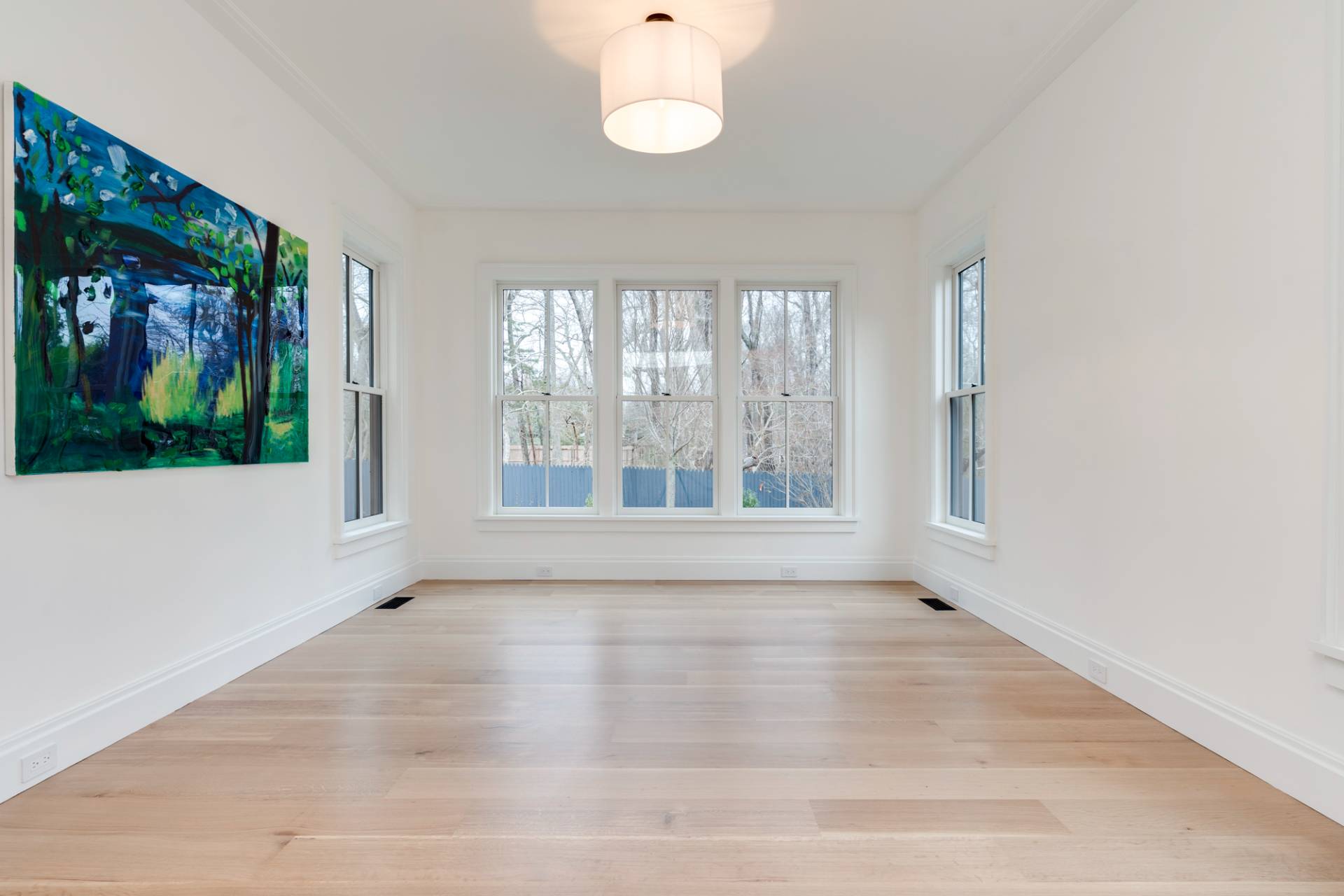 27 Sunset Road Sag Harbor, NY 11963 - Photo 20 of 45 a view of an empty room with wooden floor and a window