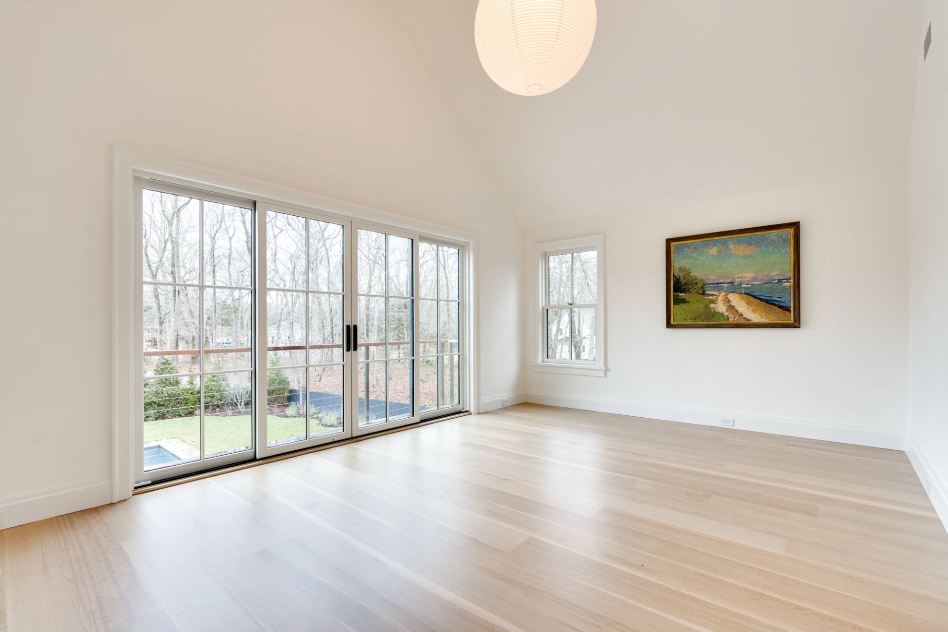 27 Sunset Road Sag Harbor, NY 11963 - Photo 24 of 45 a view of an empty room with wooden floor and a window
