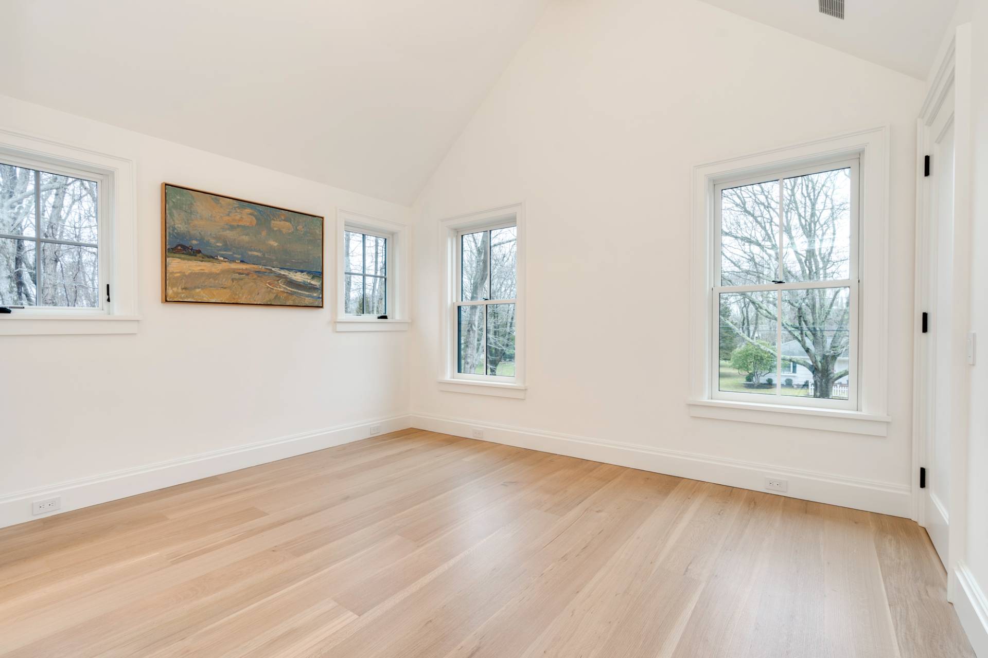 27 Sunset Road Sag Harbor, NY 11963 - Photo 29 of 45 a view of an empty room with wooden floor and a window