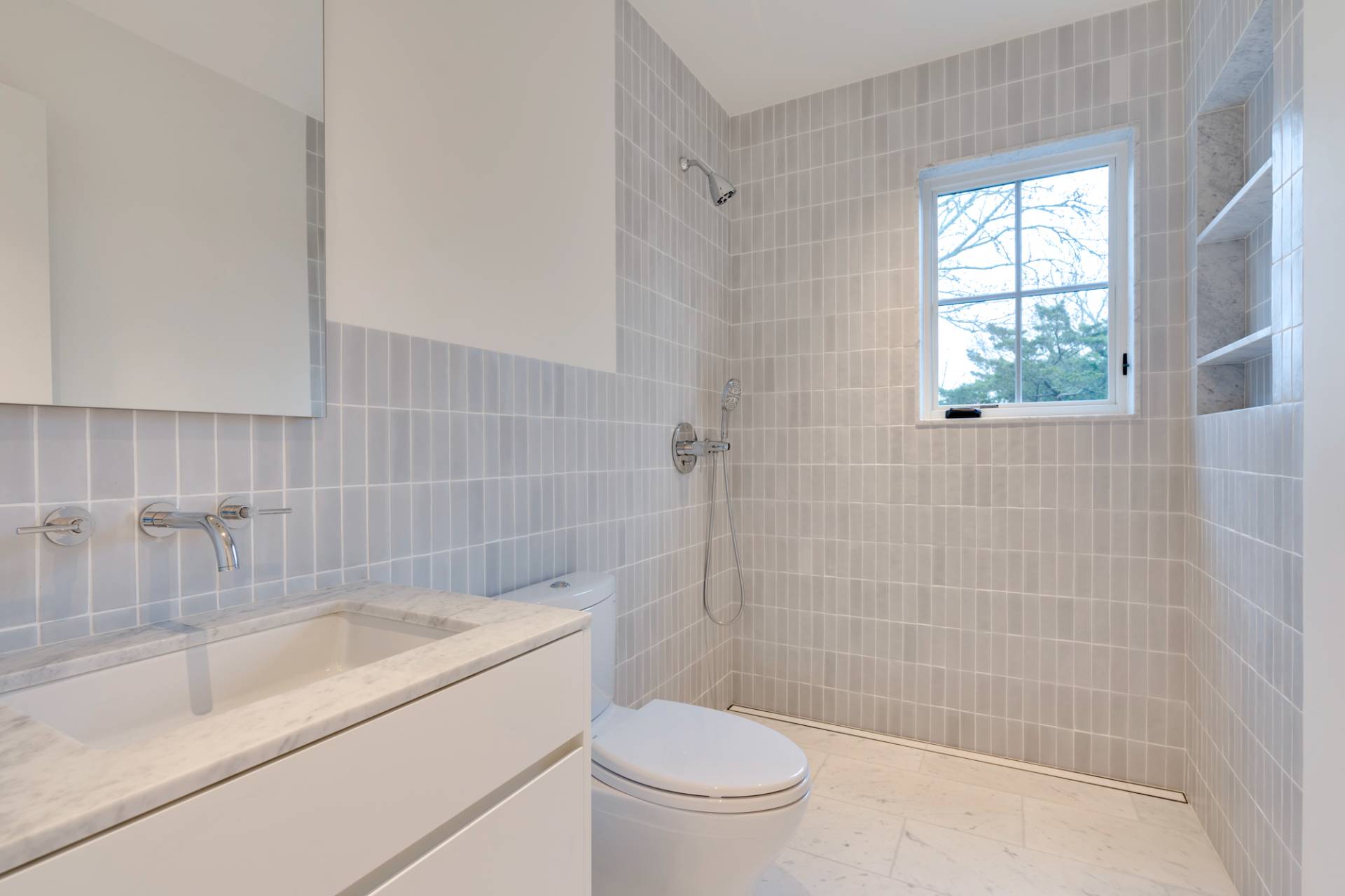 27 Sunset Road Sag Harbor, NY 11963 - Photo 33 of 45 a bathroom with a sink a toilet and shower