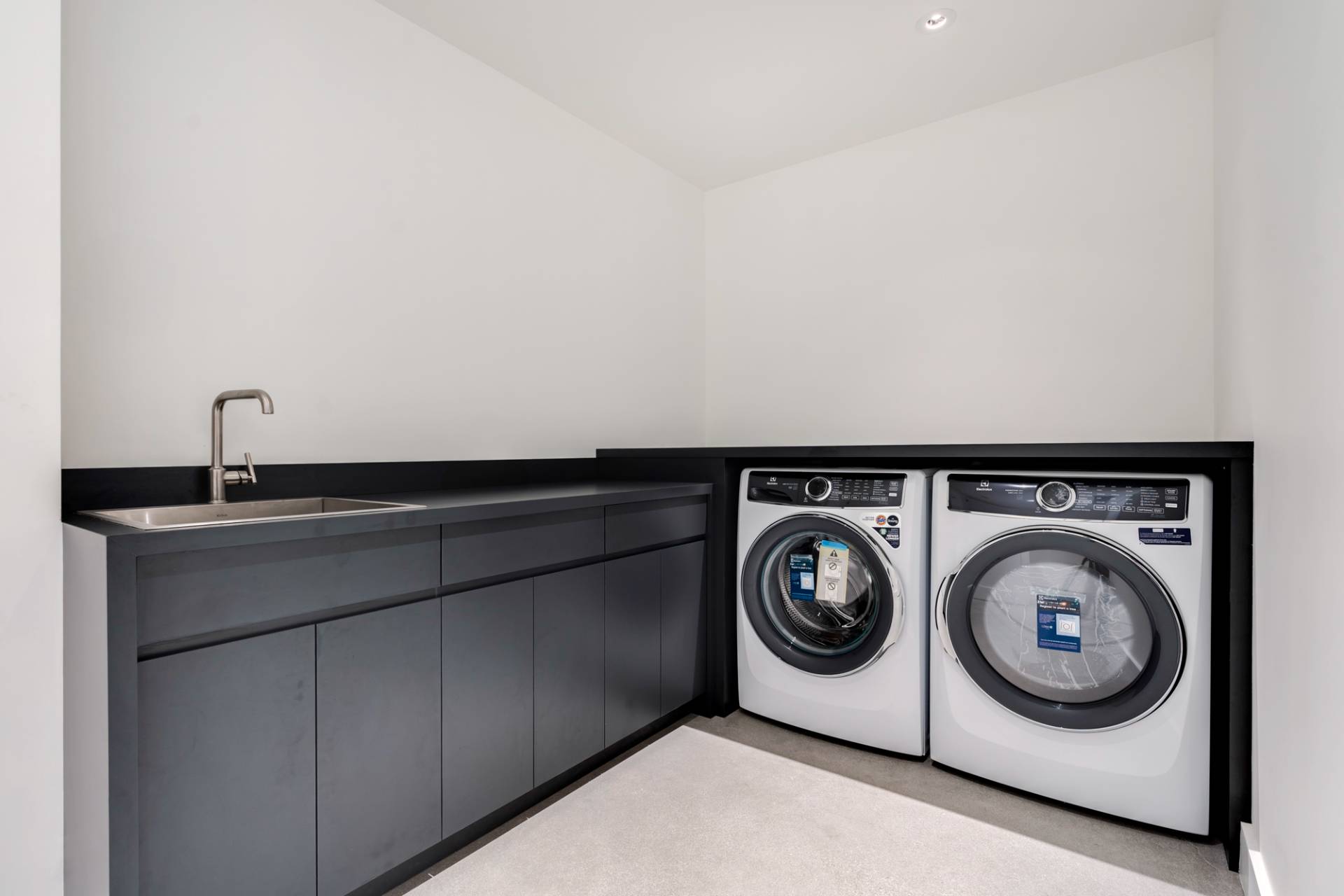 27 Sunset Road Sag Harbor, NY 11963 - Photo 40 of 45 a utility room with dryer and washer