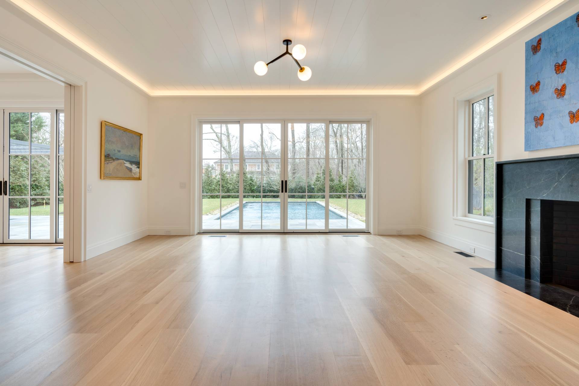 27 Sunset Road Sag Harbor, NY 11963 - Photo 10 of 45 a view of an empty room with wooden floor and a window