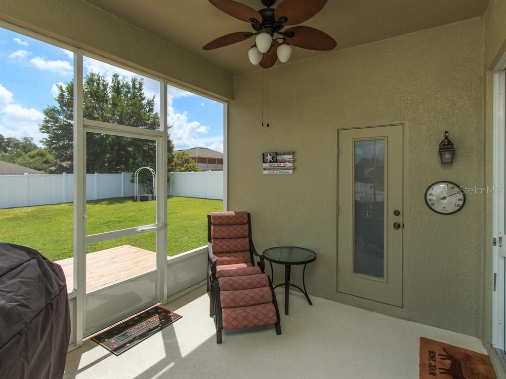 5477 Rishley Run Way Mount Dora, FL 32757 - Photo 20 of 25 a view of a room with gym equipment and a large window