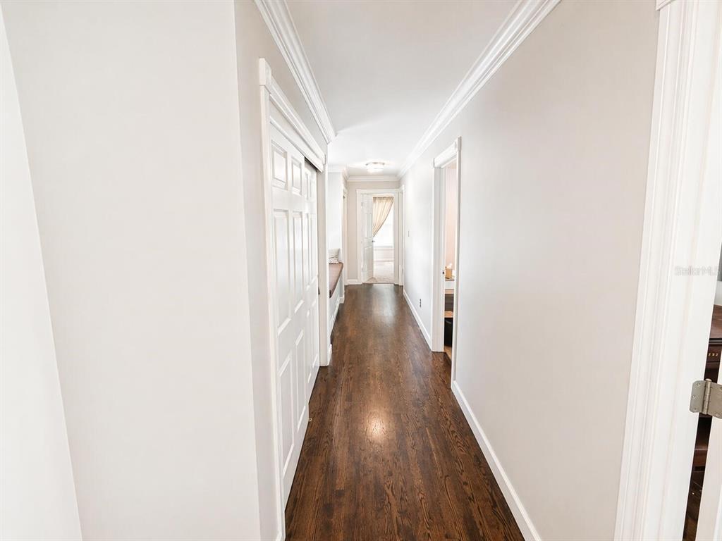 2313 Southeast 7th Street Ocala, FL 34471 - Photo 41 of 54 a view of a hallway with wooden floor