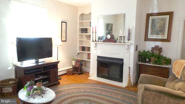 7200 Highbridge Road Bowie, MD 20720 - Photo 7 of 26 Living Room with Wood-burning Fireplace