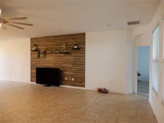 a view of an empty room with a fireplace