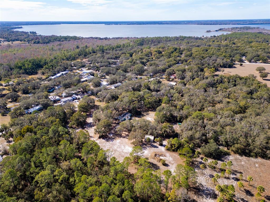 8725 Treasure Island Road Leesburg, FL 34788 - Photo 22 of 27 a view of a city with green field