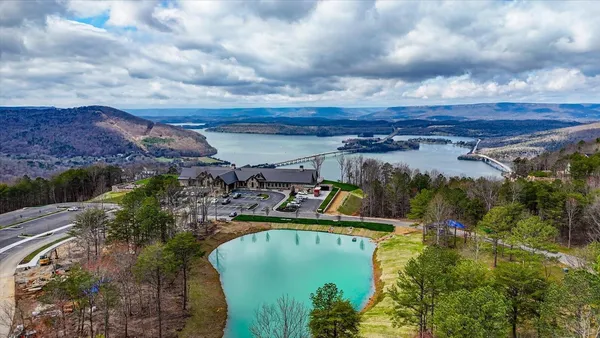 a view of a swimming pool with a yard