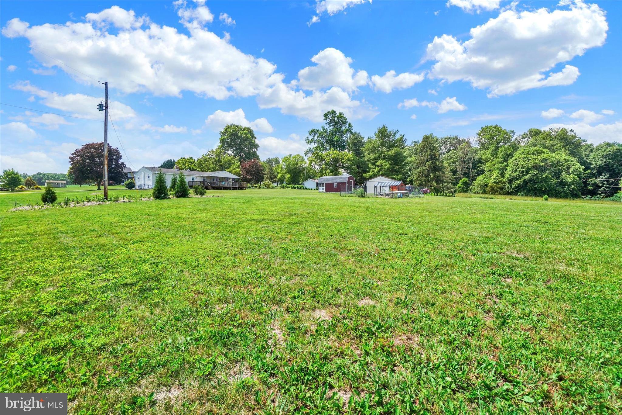 13174 Mont Road Felton, PA 17322 - Photo 14 of 39 a view of a big yard with a house in the background