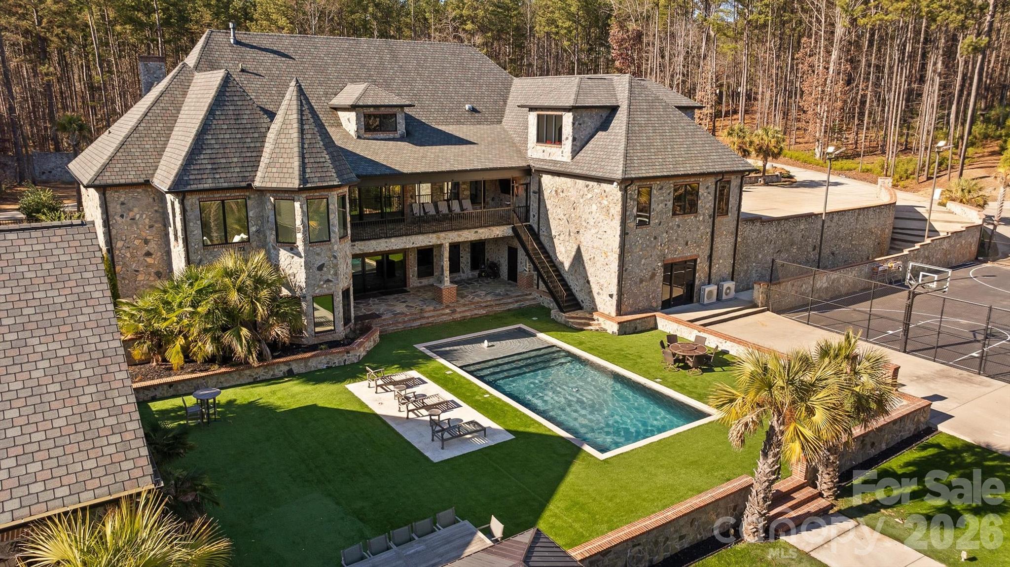 135 Stillwater Road Troutman, NC 28166 - Photo 28 of 43 an aerial view of a house with swimming pool and porch