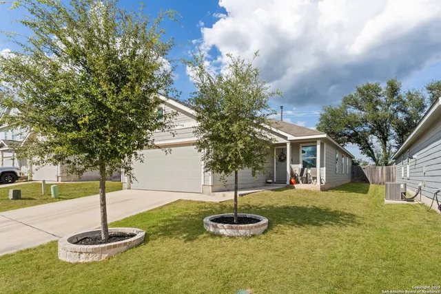 a swimming pool with a tree in the background