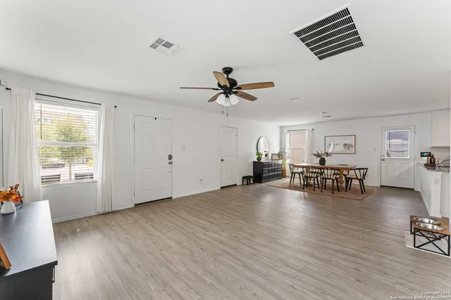 a view of living room with furniture and window