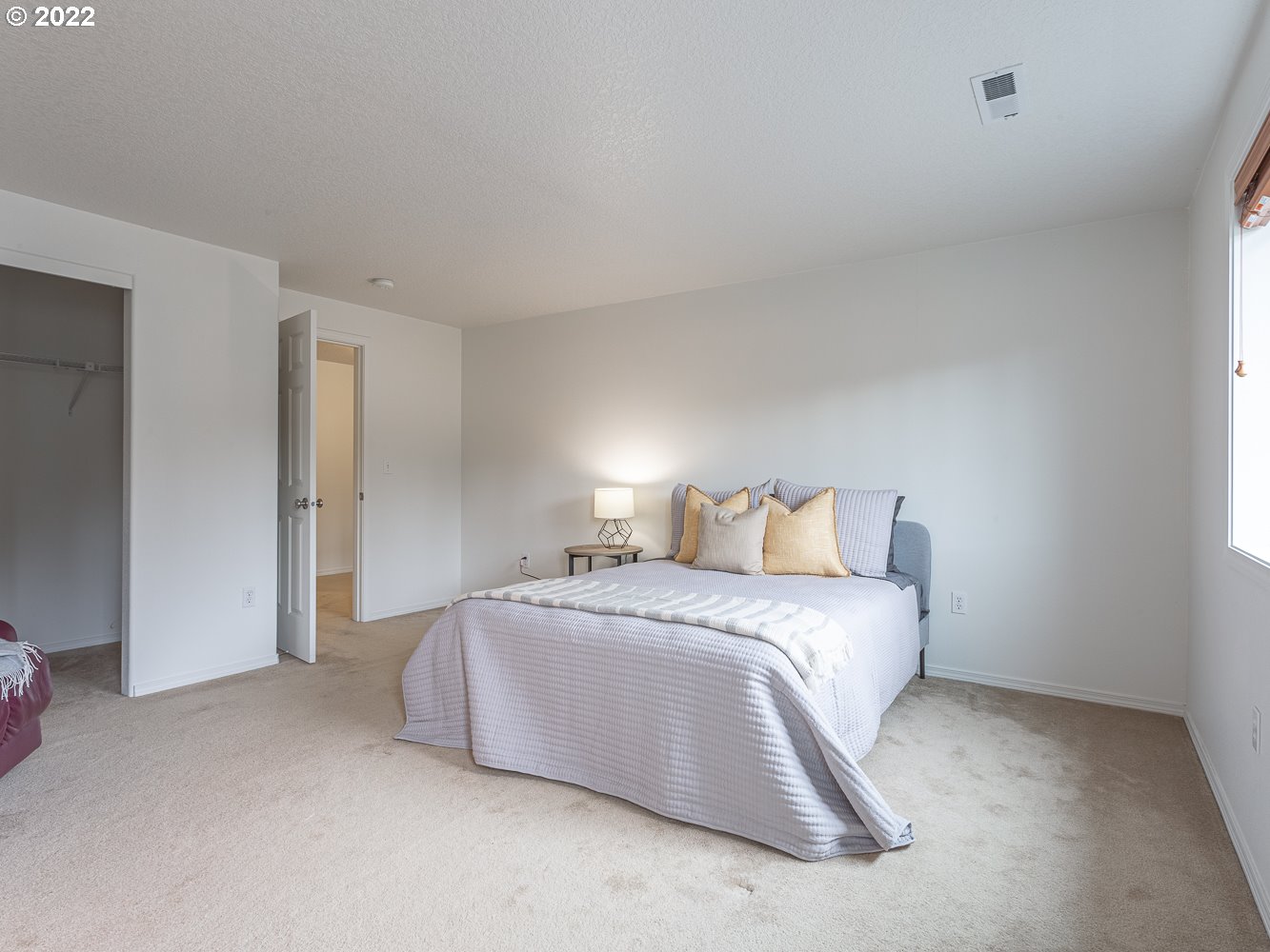 3206 South 2nd Way Ridgefield, WA 98642 - Photo 21 of 32 a bedroom with a bed and a night stand