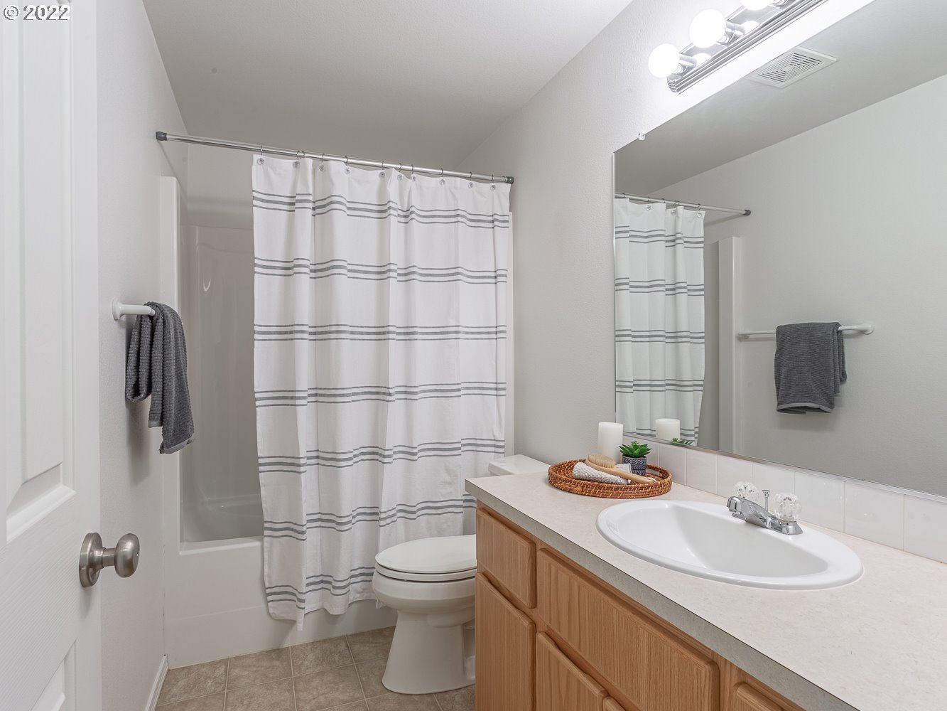 3206 South 2nd Way Ridgefield, WA 98642 - Photo 30 of 32 a bathroom with a granite countertop sink a toilet and shower