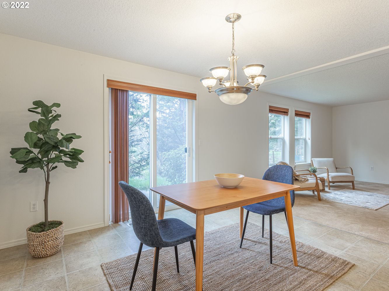 3206 South 2nd Way Ridgefield, WA 98642 - Photo 9 of 32 a view of a dining room with furniture window and wooden floor