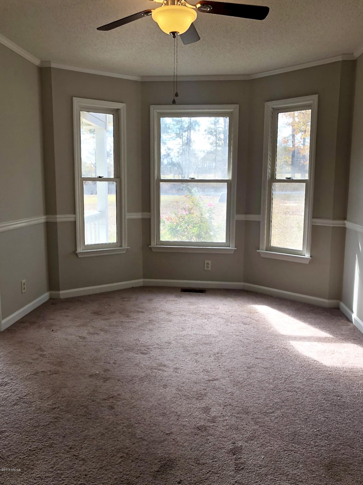 230 J R Boulevard Macon, GA 31220 - Photo 4 of 12 an empty room that has a window