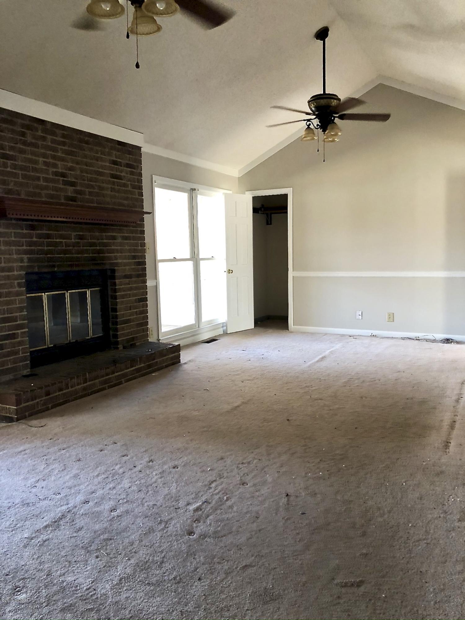 230 J R Boulevard Macon, GA 31220 - Photo 10 of 12 a view of empty room with a fireplace