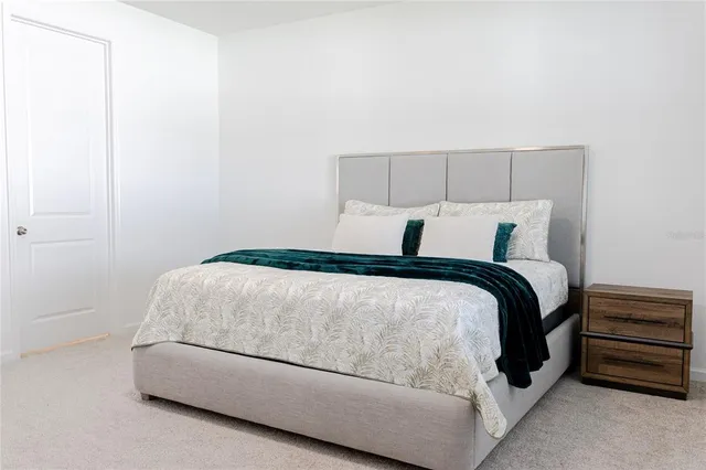 an aerial view of a house with a lake view