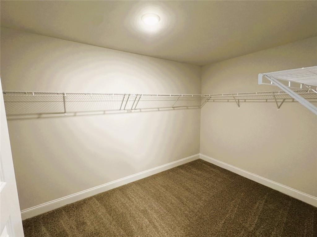 2180 Highridge Point Drive Lithia Springs, GA 30122 - Photo 17 of 24 a view of a room with racks on the wall