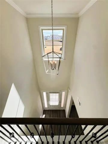 a view of wooden floor and windows in a room