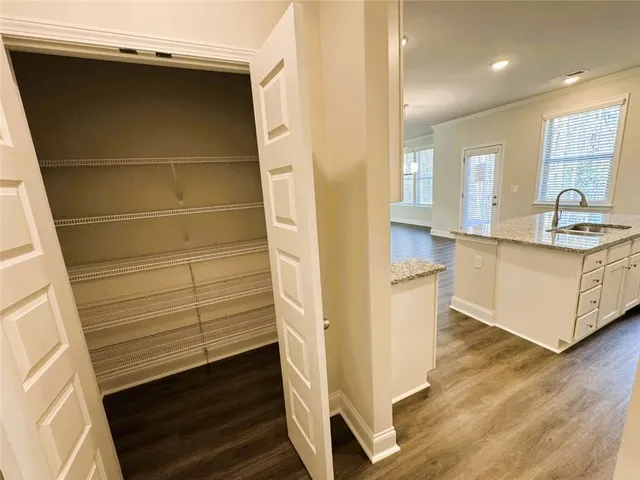 a kitchen with a sink and cabinets