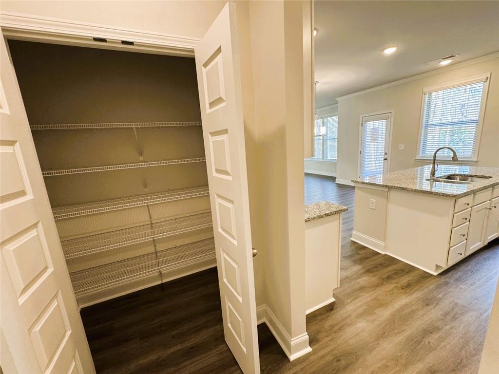 2180 Highridge Point Drive Lithia Springs, GA 30122 - Photo 10 of 24 a kitchen with a sink and cabinets