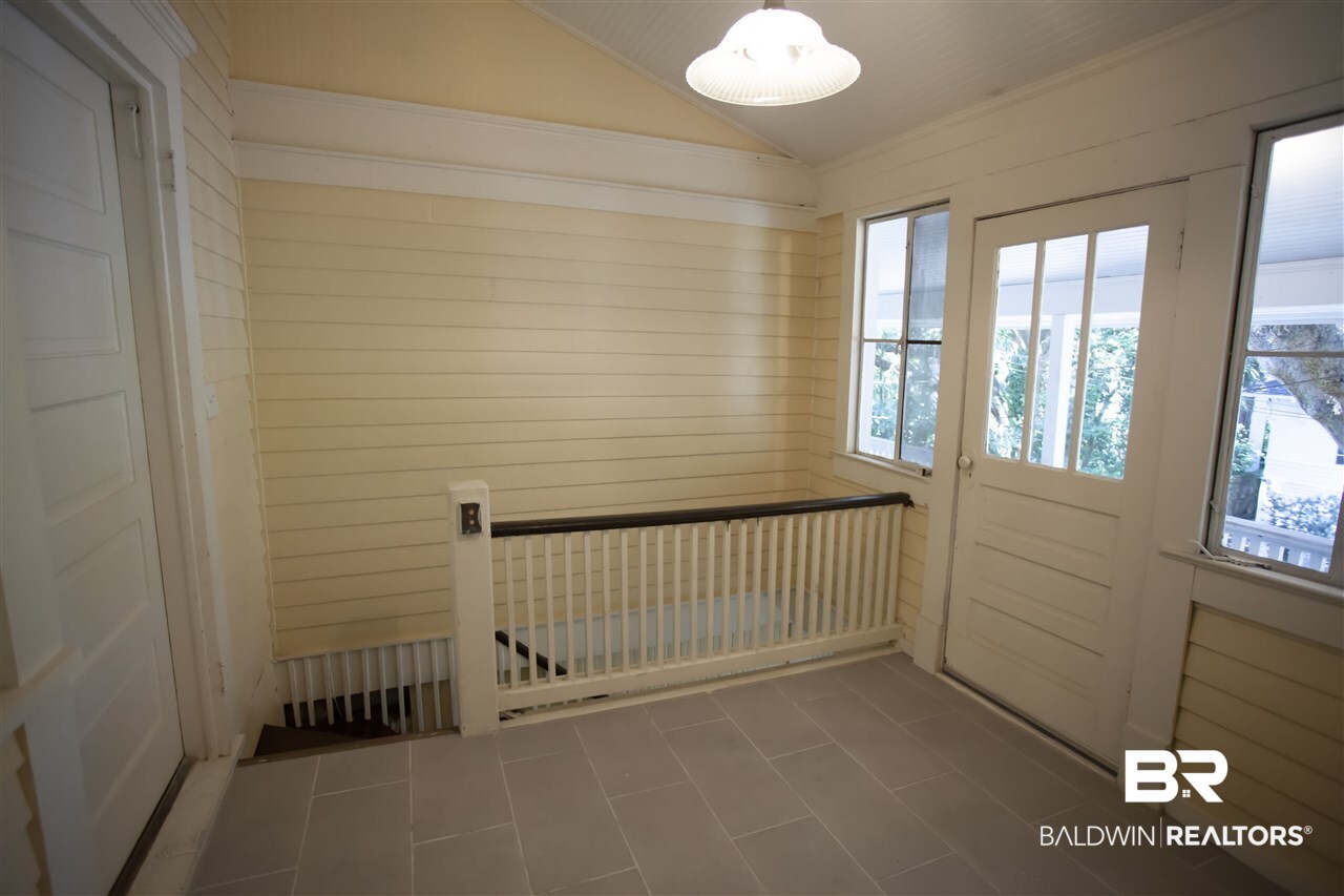 1658 Government Street Mobile, AL 36604 - Photo 16 of 36 Back stair landing with door to covered balcony