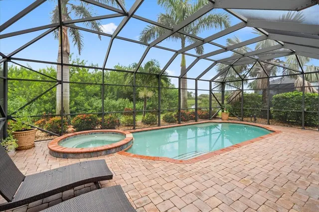 a view of a swimming pool with a patio