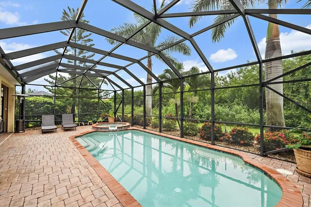 a view of a swimming pool with a patio