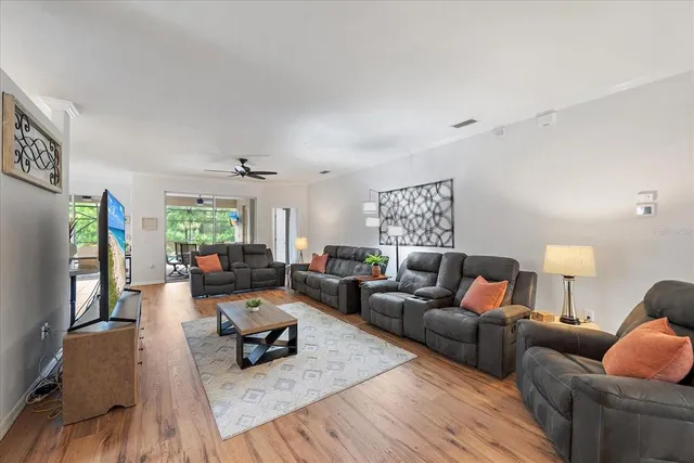 a living room with furniture and a large window