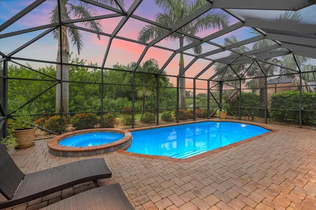 a view of a swimming pool with a patio