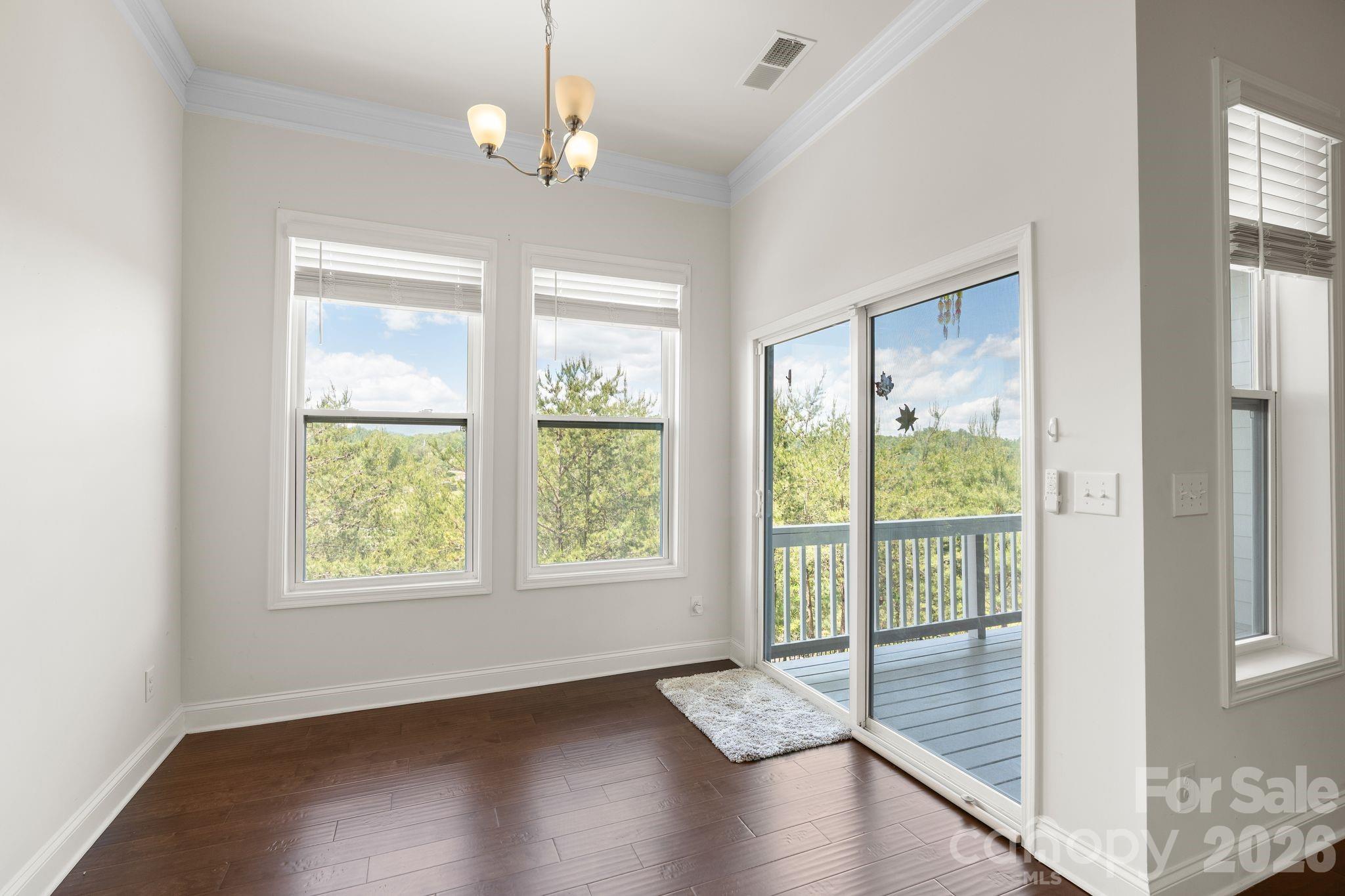 34 Rose Creek Road Leicester, NC 28748 - Photo 11 of 37 a view of an empty room with wooden floor and a window