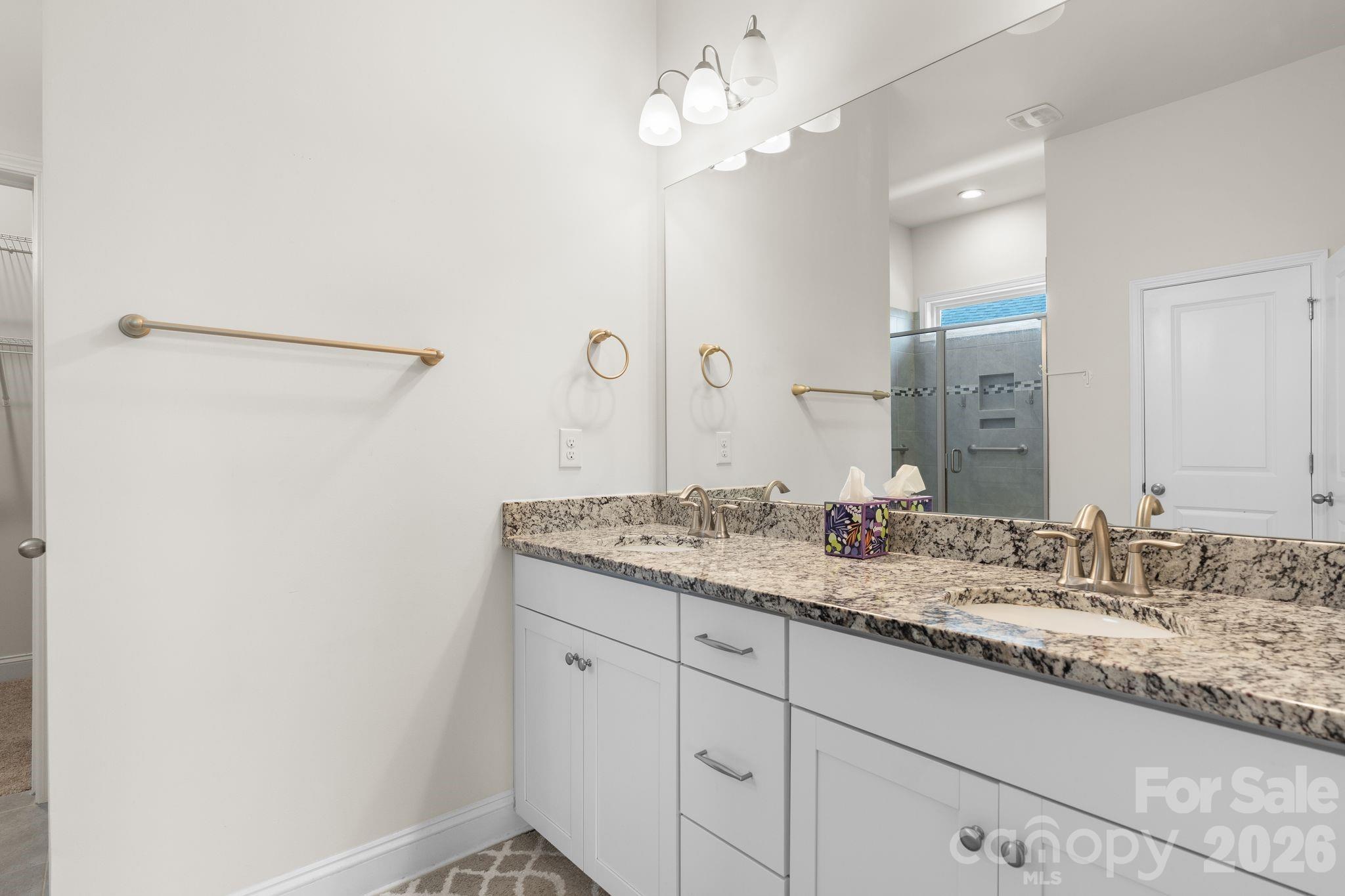34 Rose Creek Road Leicester, NC 28748 - Photo 22 of 37 a bathroom with a granite countertop sink and a mirror