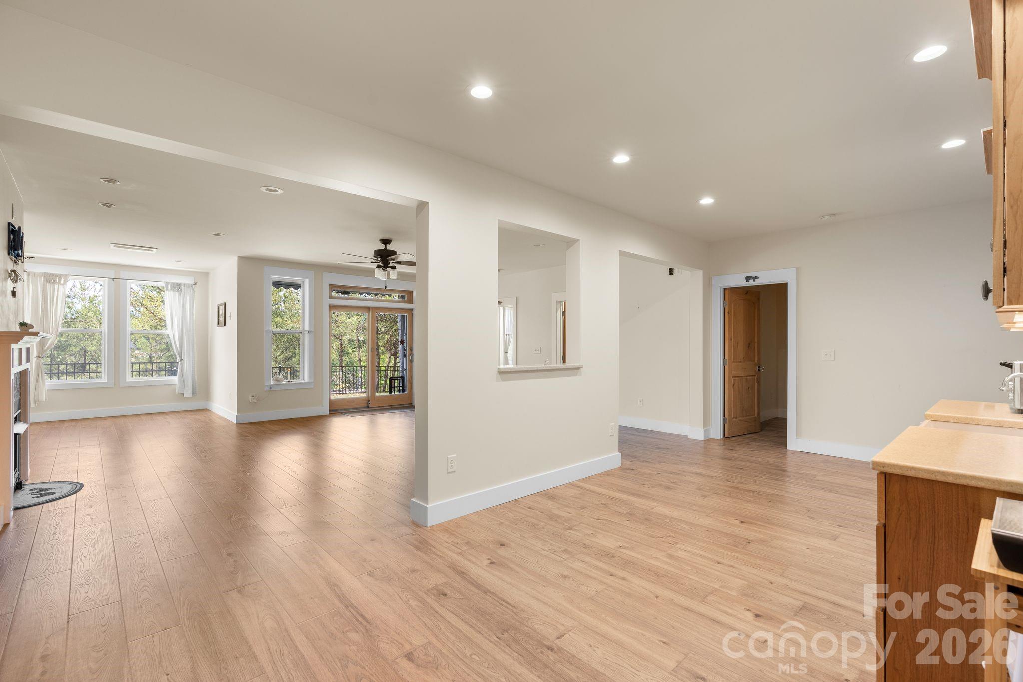 34 Rose Creek Road Leicester, NC 28748 - Photo 25 of 37 a view of an empty room with wooden floor and a window