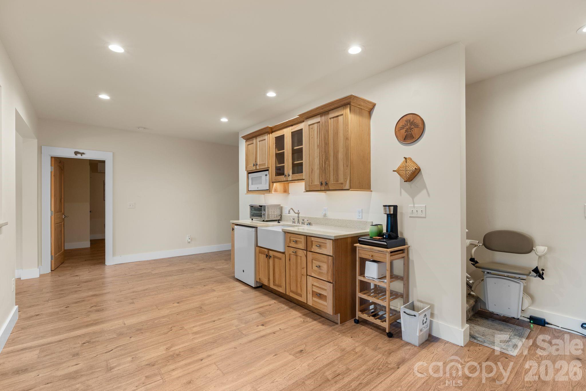 34 Rose Creek Road Leicester, NC 28748 - Photo 26 of 37 a kitchen with stainless steel appliances granite countertop a stove and a wooden floors