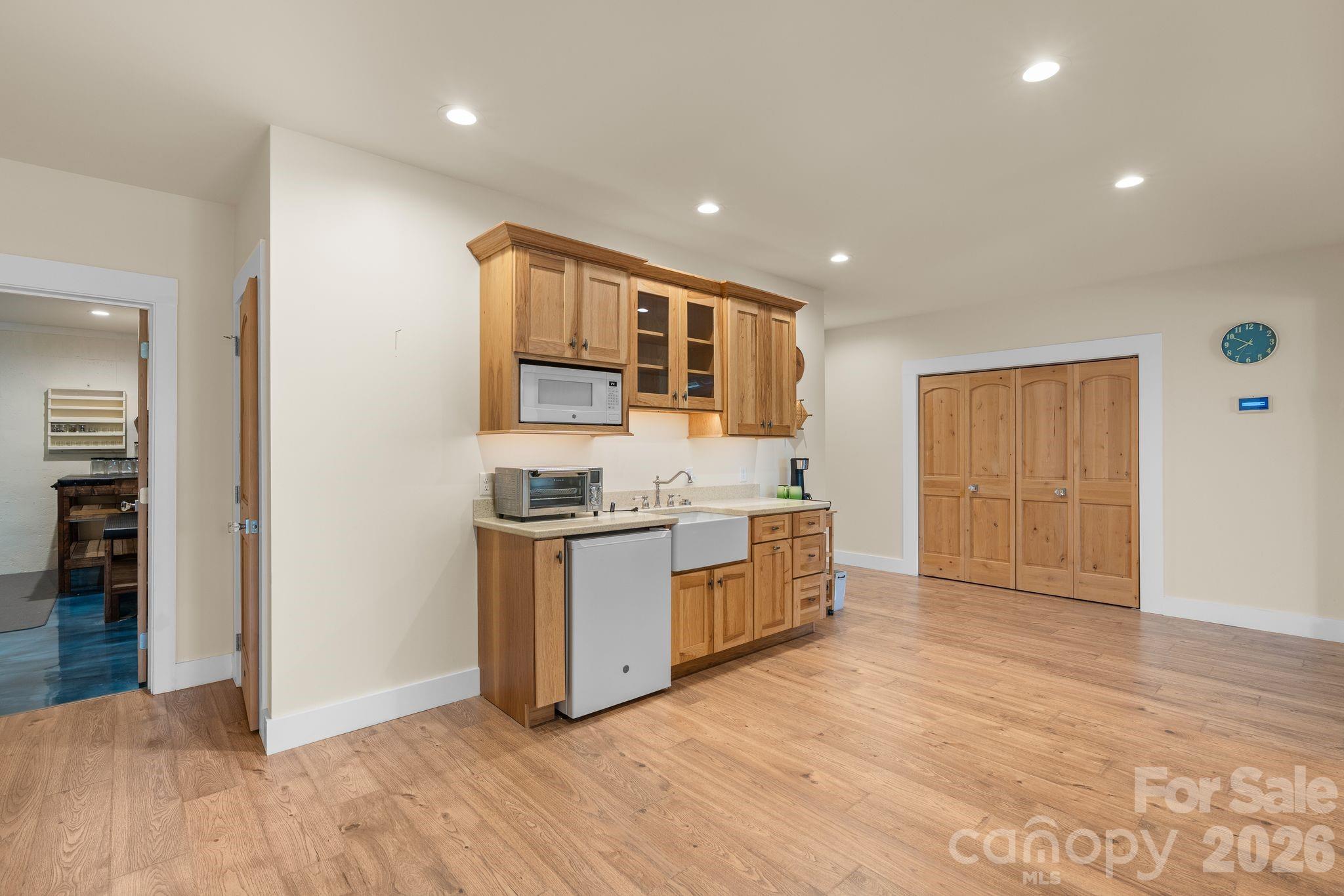 34 Rose Creek Road Leicester, NC 28748 - Photo 27 of 37 a kitchen with stainless steel appliances granite countertop a stove and a sink