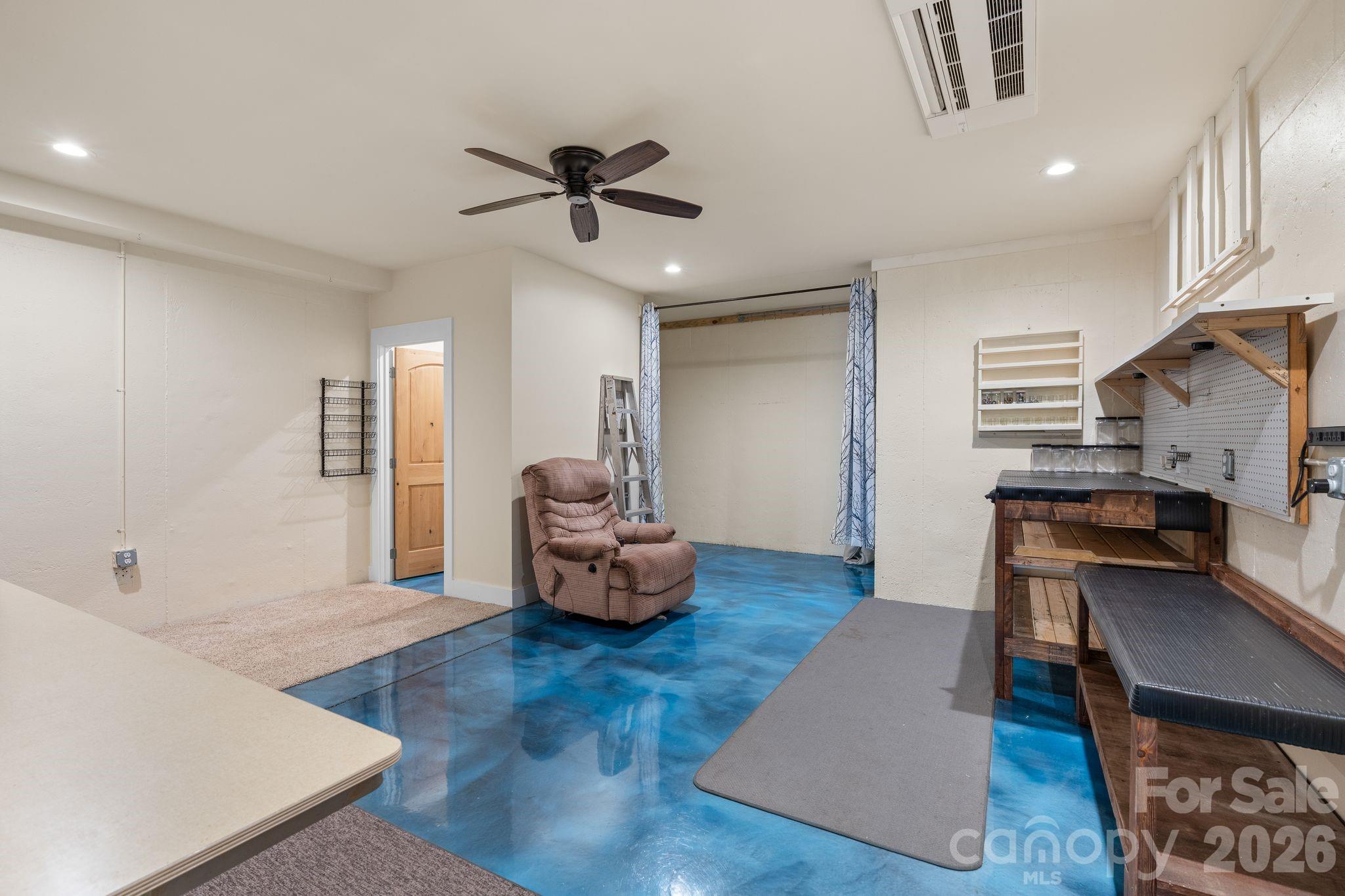 34 Rose Creek Road Leicester, NC 28748 - Photo 28 of 37 a living room with furniture and a wooden floor