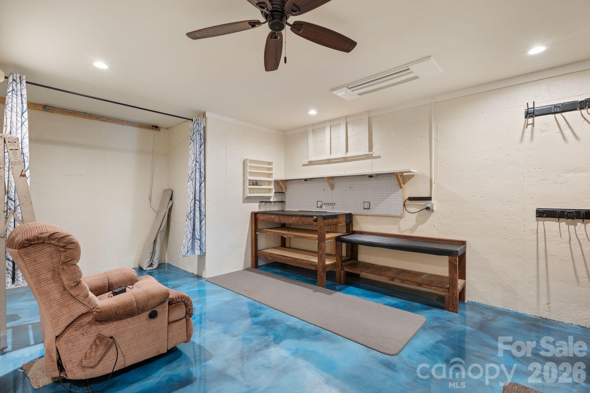 34 Rose Creek Road Leicester, NC 28748 - Photo 29 of 37 a living room with furniture and a ceiling fan
