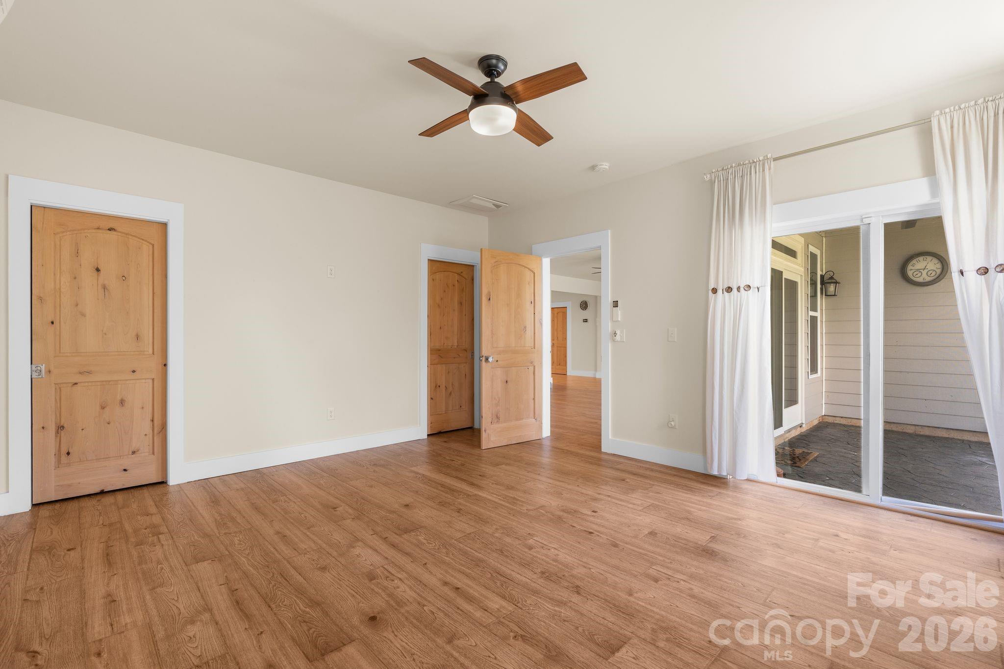34 Rose Creek Road Leicester, NC 28748 - Photo 34 of 37 an empty room with closet and a ceiling fan