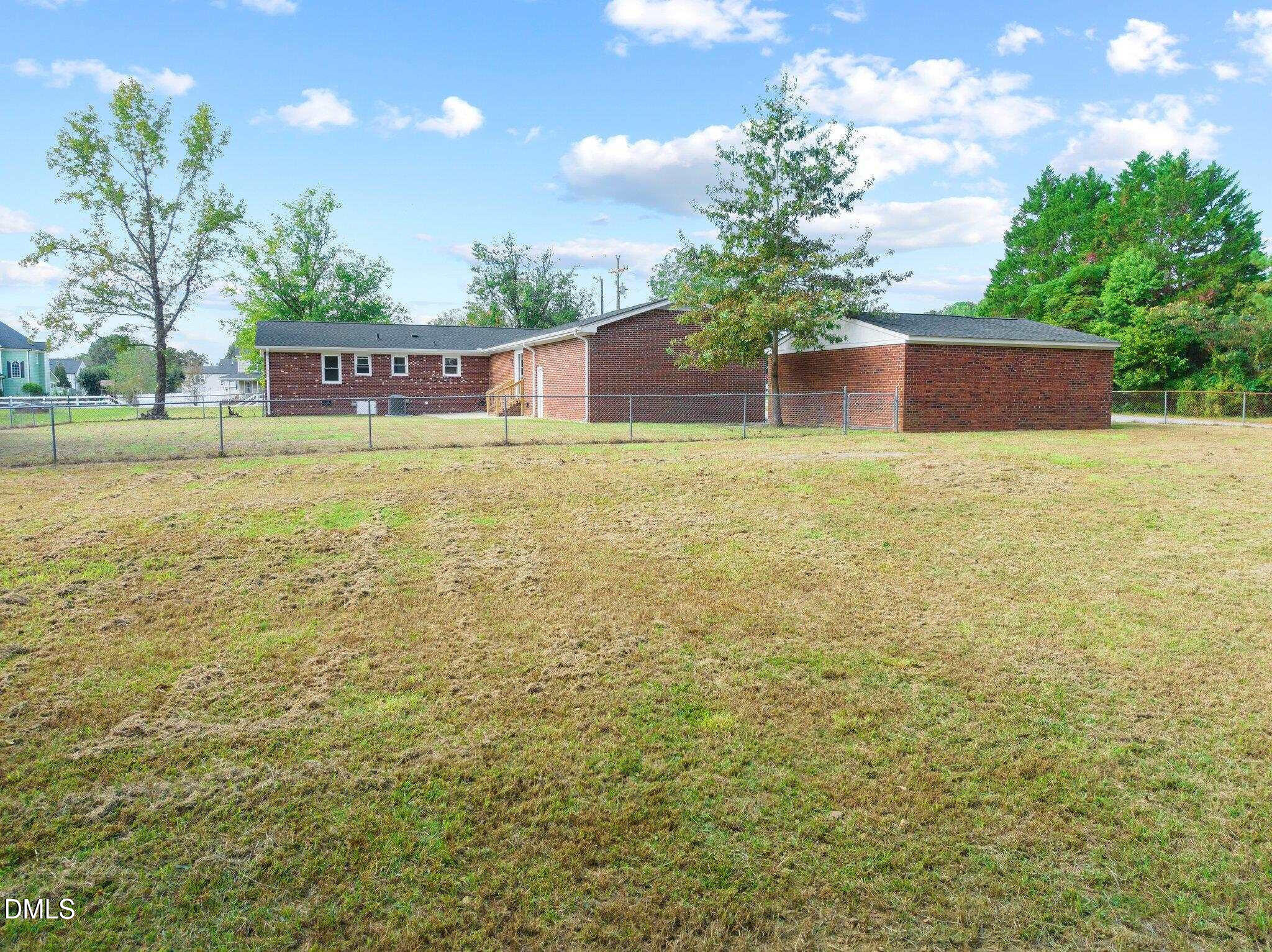 6501 Rock Service Station Road Raleigh, NC 27603 - Photo 13 of 49 a view of an outdoor space and a yard