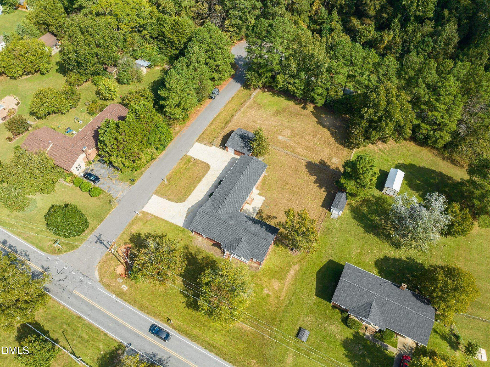 6501 Rock Service Station Road Raleigh, NC 27603 - Photo 22 of 49 an aerial view of a residential houses with yard