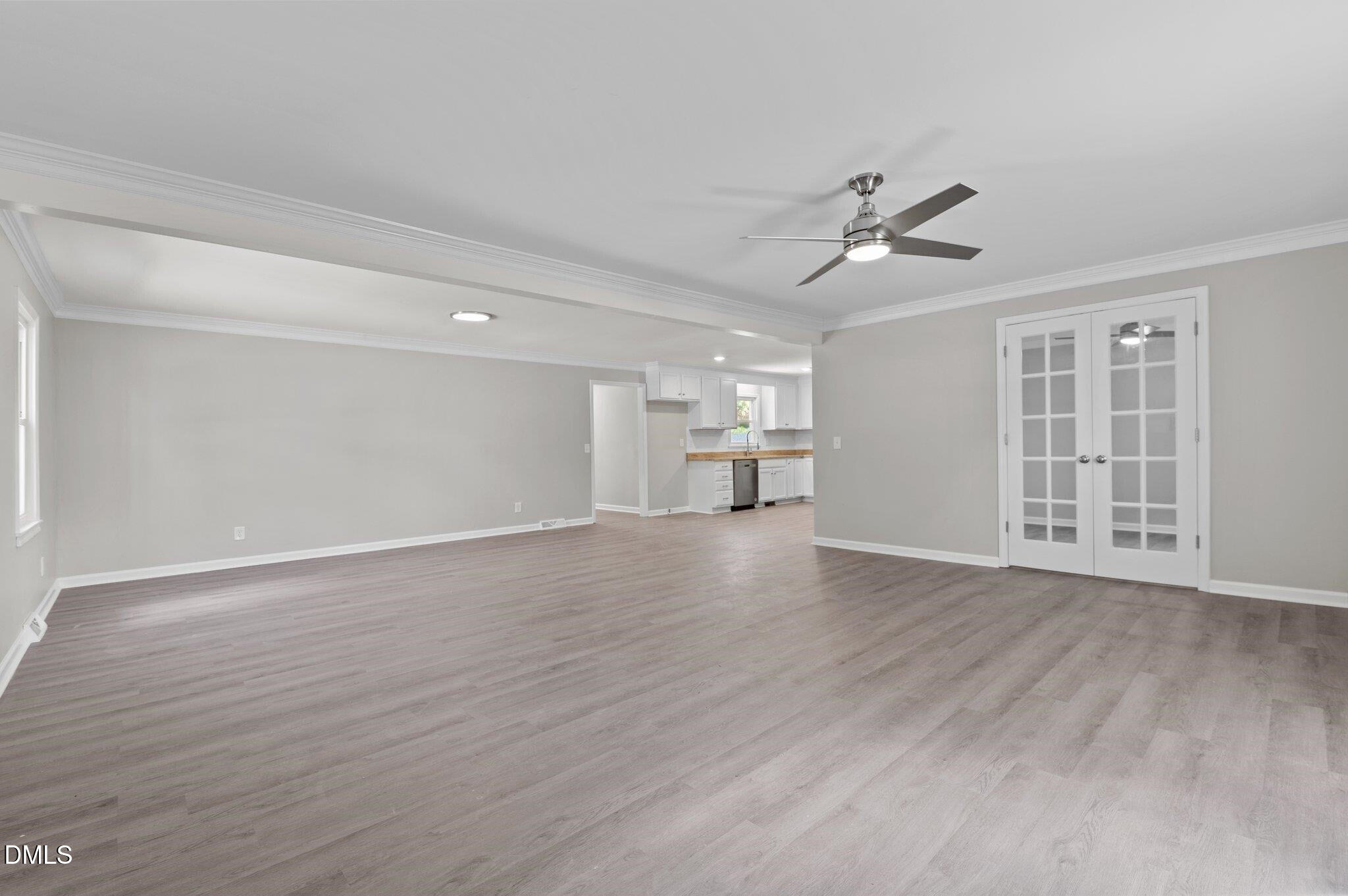 6501 Rock Service Station Road Raleigh, NC 27603 - Photo 23 of 49 a view of empty room with wooden floor and ceiling fan