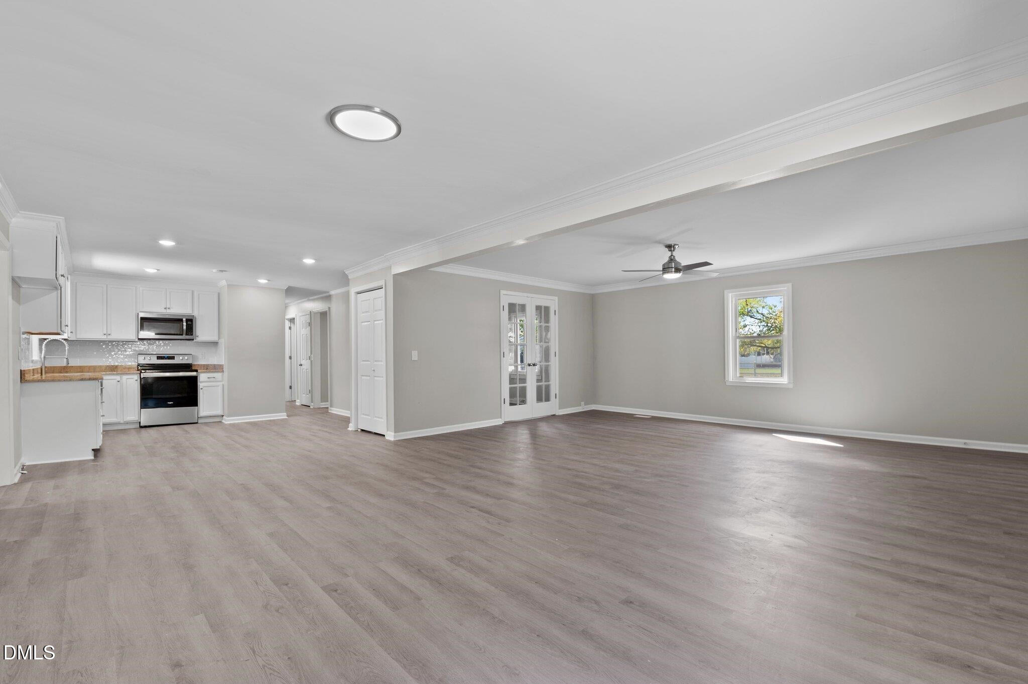 6501 Rock Service Station Road Raleigh, NC 27603 - Photo 24 of 49 a view of empty room with wooden floor and window