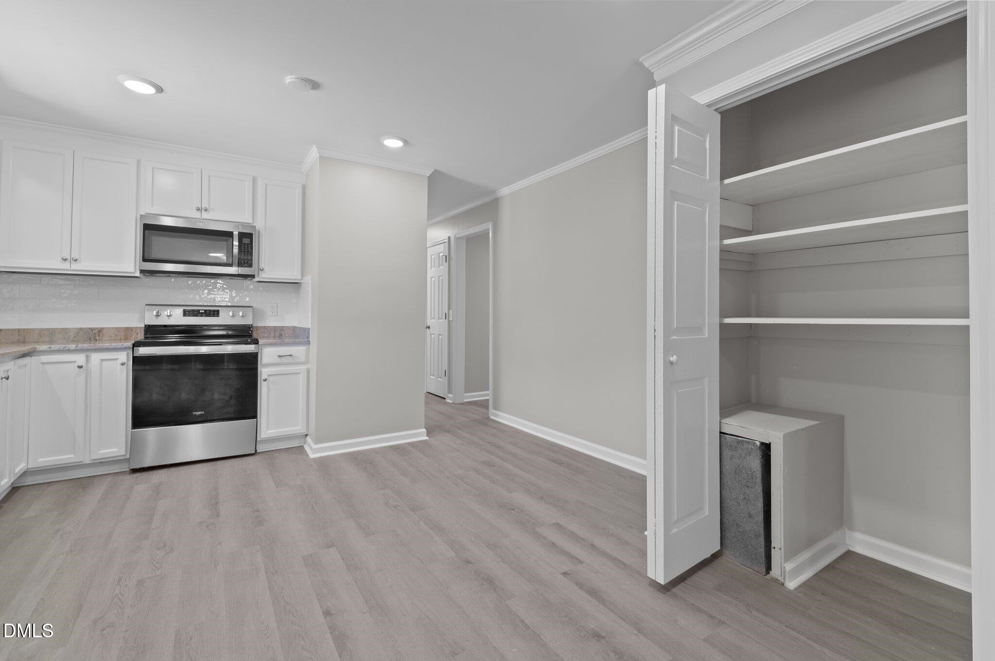 6501 Rock Service Station Road Raleigh, NC 27603 - Photo 30 of 49 a view of kitchen with wooden floor electronic appliances and window