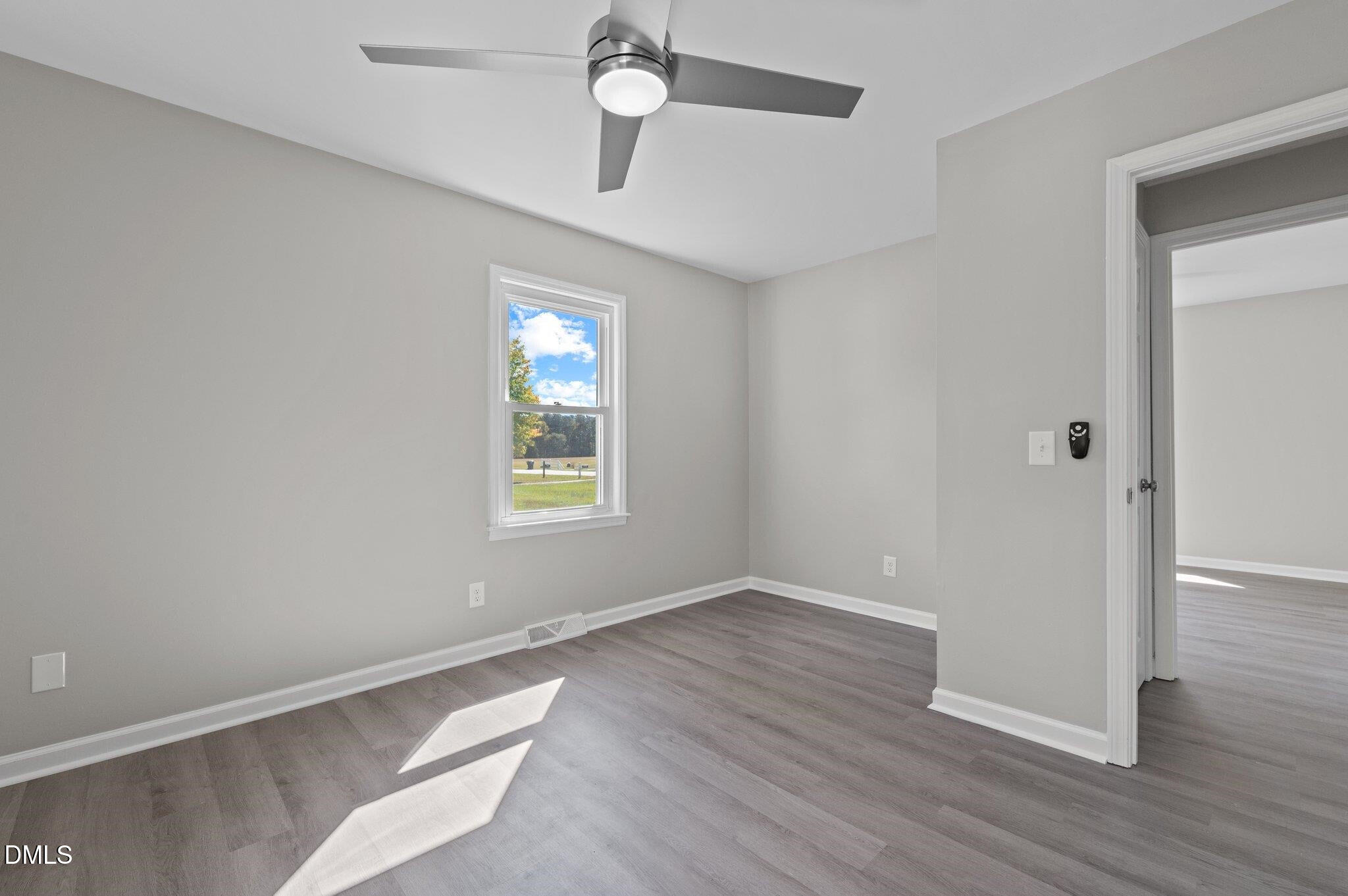 6501 Rock Service Station Road Raleigh, NC 27603 - Photo 40 of 49 wooden floor in an empty room with a window