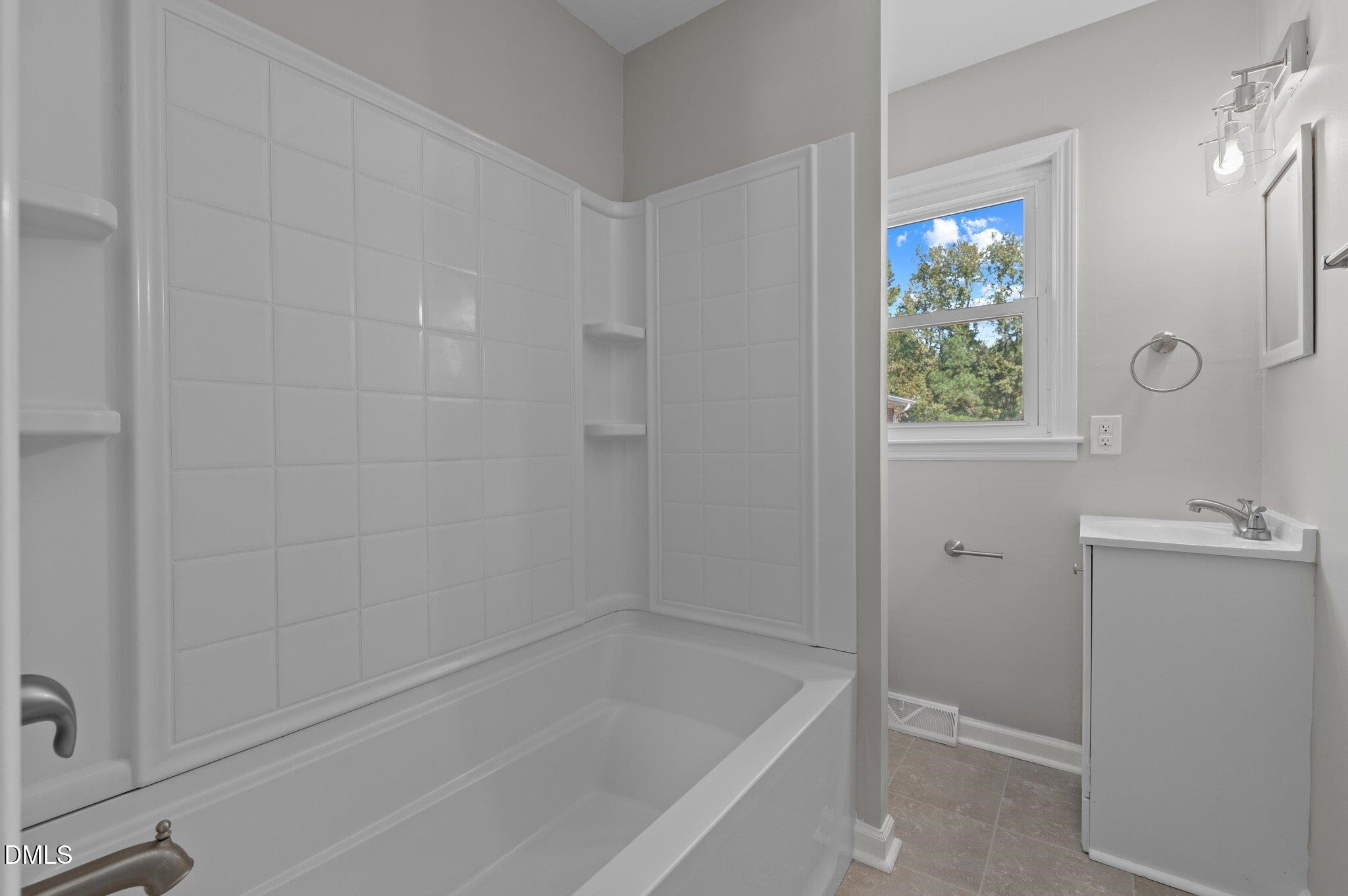 6501 Rock Service Station Road Raleigh, NC 27603 - Photo 46 of 49 a bathroom with a bathtub