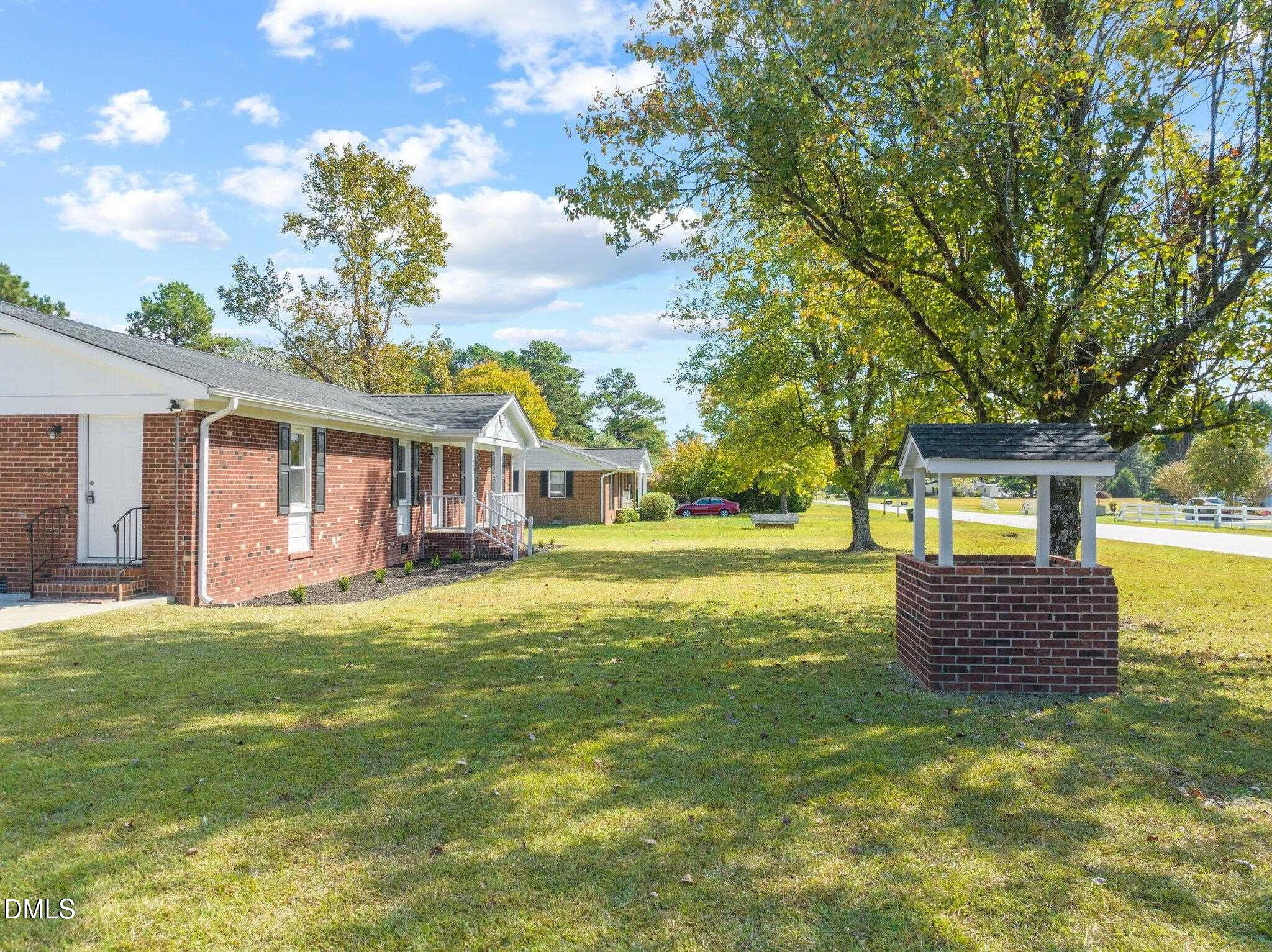 6501 Rock Service Station Road Raleigh, NC 27603 - Photo 7 of 49 a front view of a house with a garden