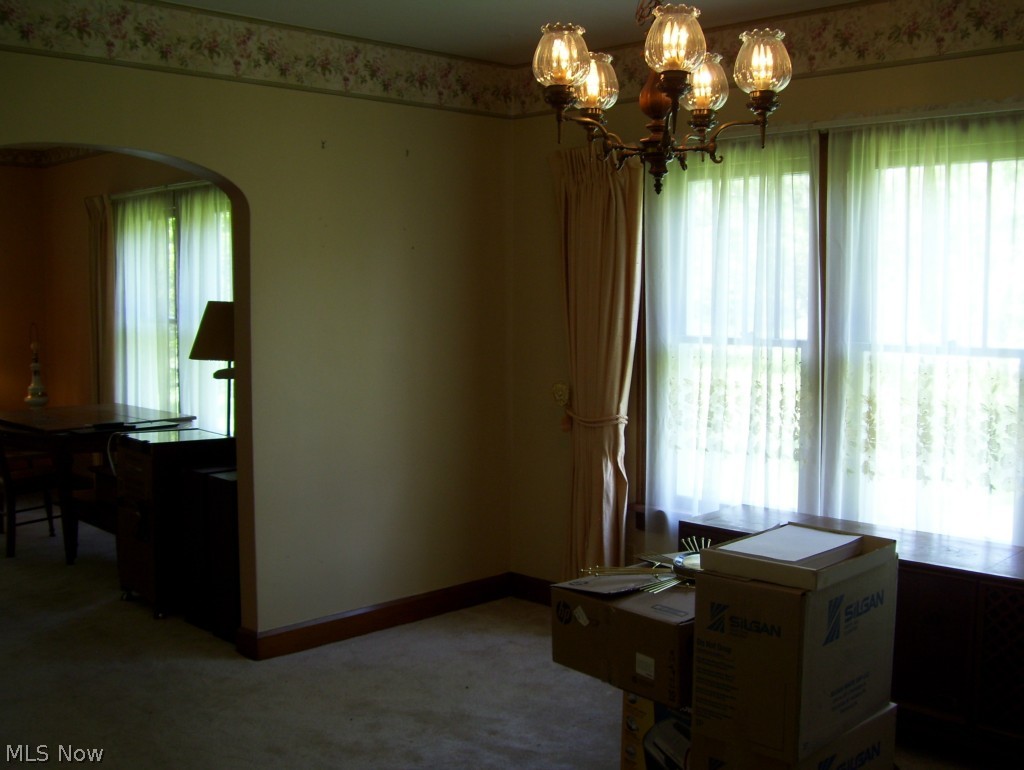 4115 Broadview Road Richfield, OH 44286 - Photo 6 of 10 Dining area and living room. Lots of windows! ALL woodwork left natural (except kitchen)