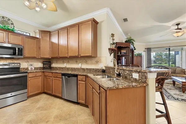 a view of a dining room and kitchen